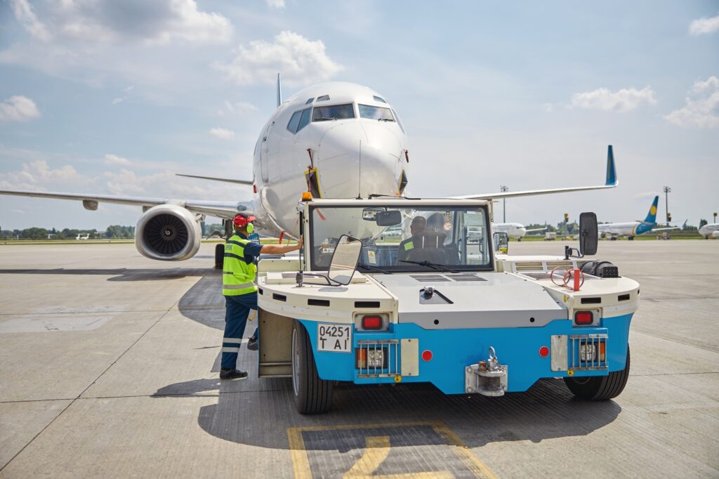 Man in headset and a truck driver at the airport